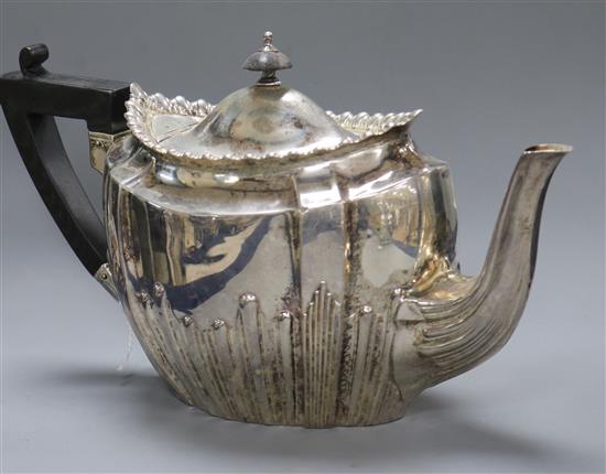 A late Victorian demi fluted silver teapot by James Dixon & Sons, Sheffield, 1900, gross 14 oz.